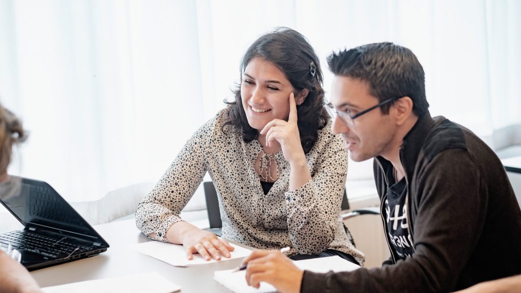 Picture of two researchers laughing